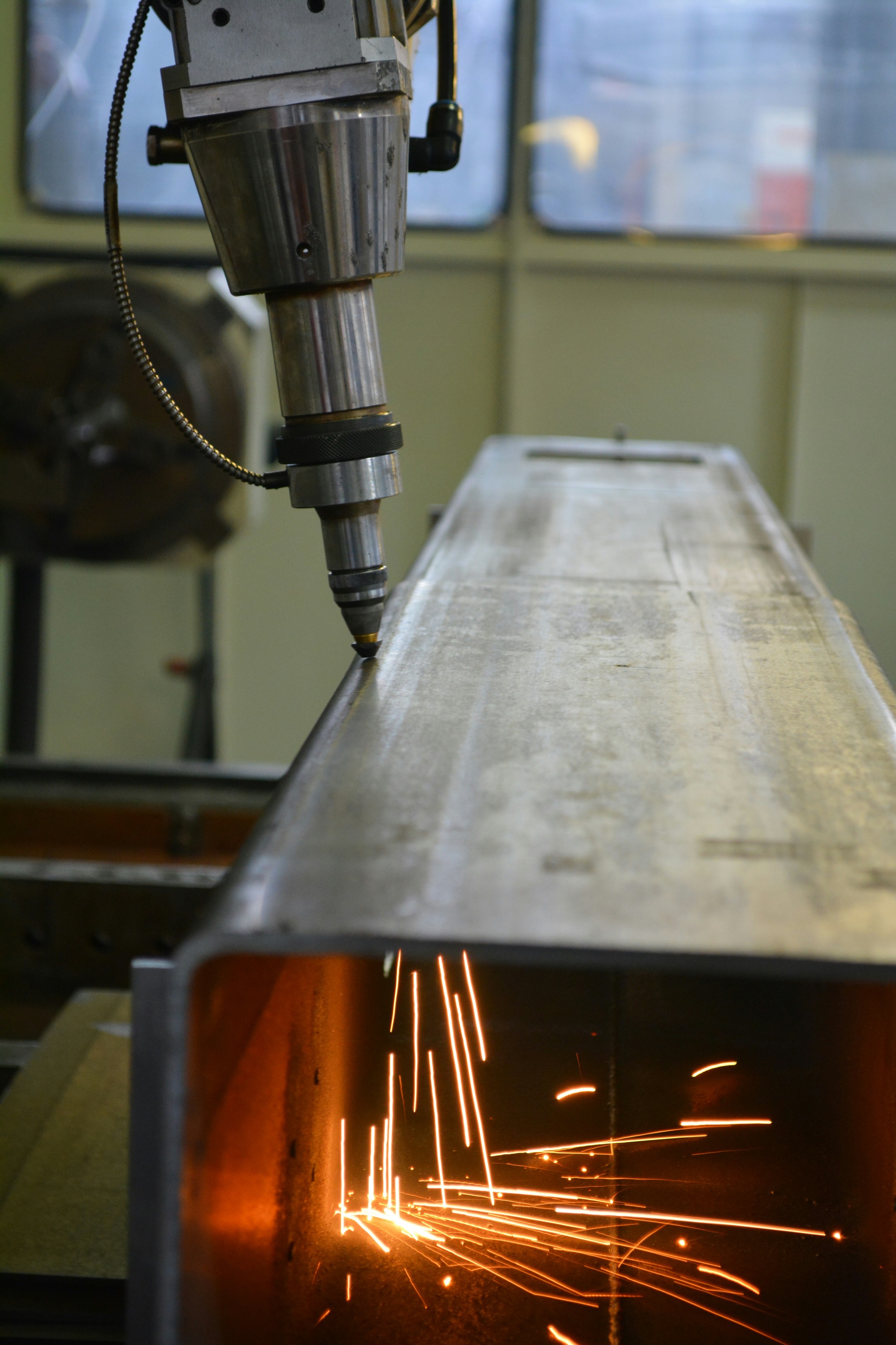Gray and black welding machine equipment in a workshop